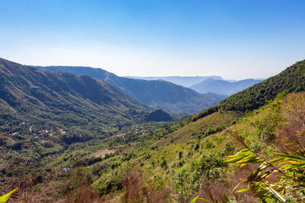 istock mountain range covered with dense green forests and bright blue sky at morning 1372149745