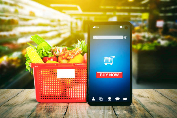istock Cellphone displaying buy now button near groceries 1372149876