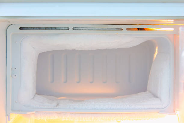freezer compartment of the refrigerator is very thick with ice freezer compartment of the refrigerator is very thick with ice at home freezer stock pictures, royalty-free photos & images