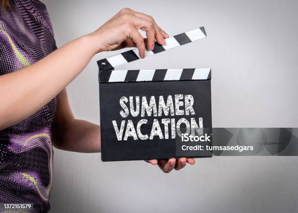 Summer Vacation Female Hands Holding Movie Clapper Stock Photo - Download Image Now