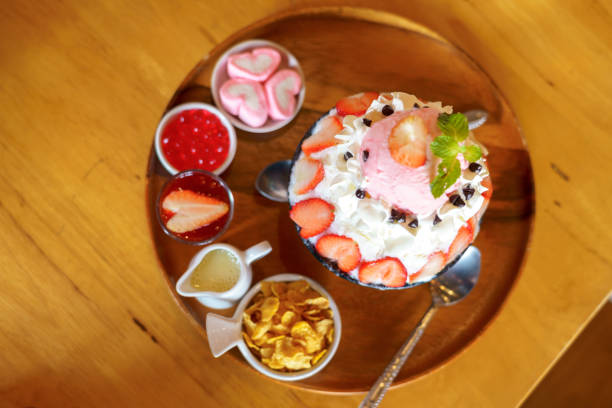 istock Strawberry bingsu placed on a wooden table 1372152290