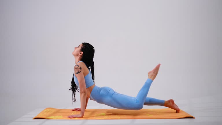 Young woman doing side plank pose