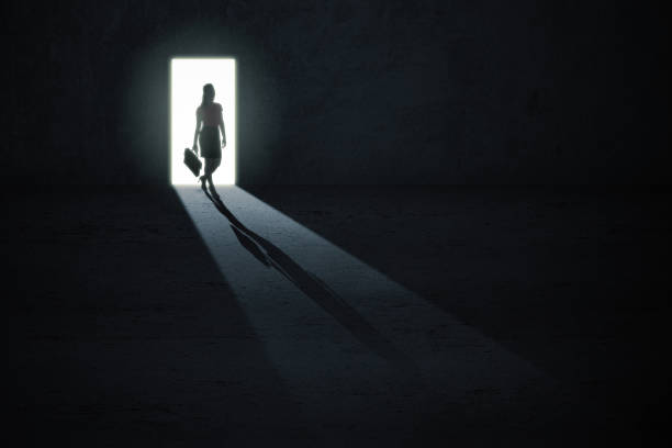 istock Businesswoman entering dark room 1372155185