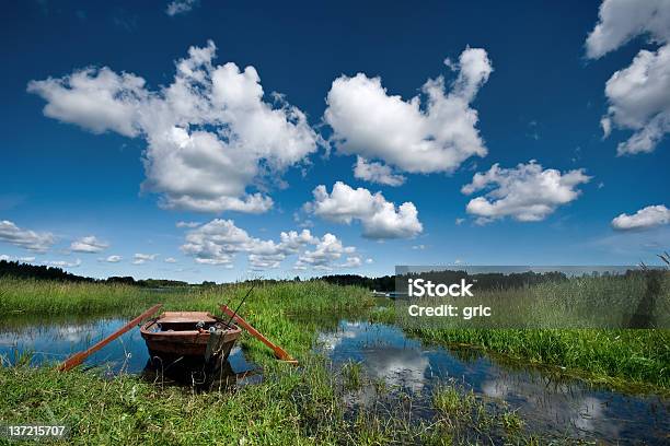 Lake With Fisherman Boat Stock Photo - Download Image Now - Backgrounds, Blue, Coastline