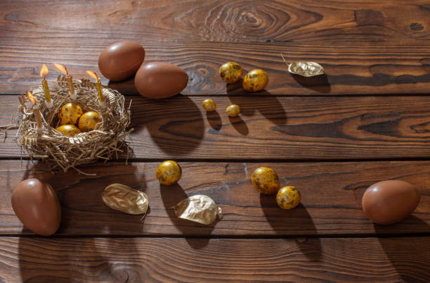 istock golden and chocolate easter eggs on dark wooden background 1372157261