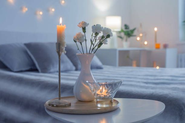 istock white flowers in vase on table in bedroom in night 1372157285