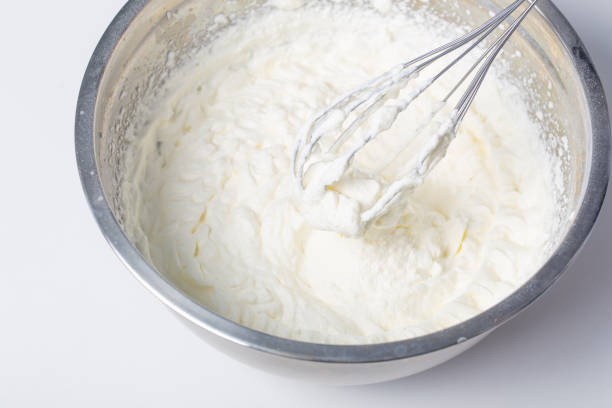 istock white whipped cream in metal bowl 1372157390