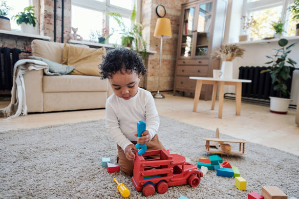 istock Little boy playing car mechanic 1372158767