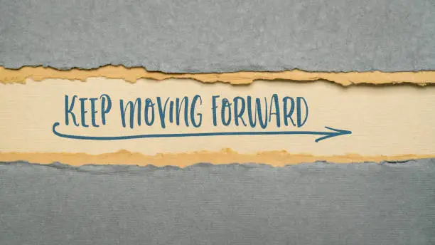 keep moving forward inspirational reminder - handwriting on a handmade rag paper, web banner