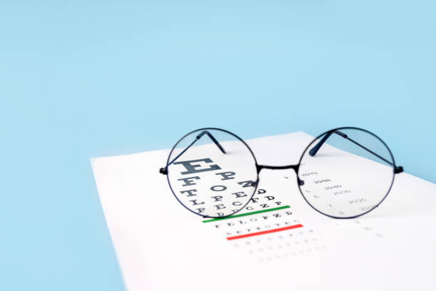istock A table for checking vision and glasses on a light blue background. a concept for an ophthalmology clinic or the sale of optics 1372159999