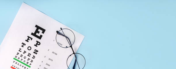 istock A table for checking vision and glasses on a light blue background. a concept for an ophthalmology clinic or the sale of optics 1372160275