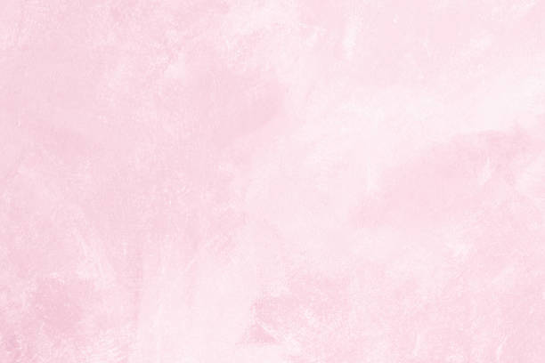 Pink colored abstract textured background. Decorative plaster on the wall.