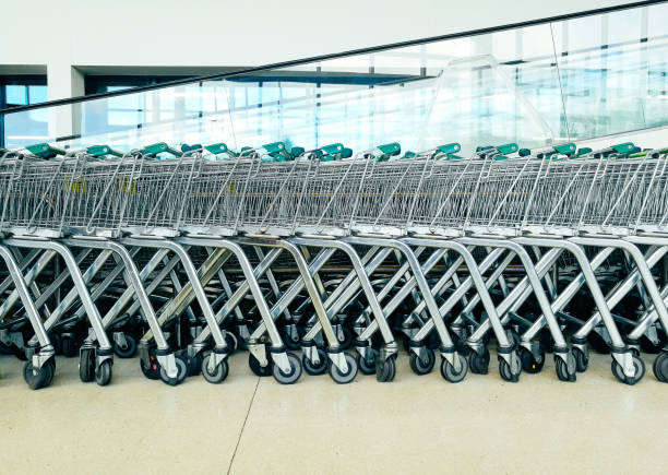Shopping trollies in a row at the supermarket stock photo