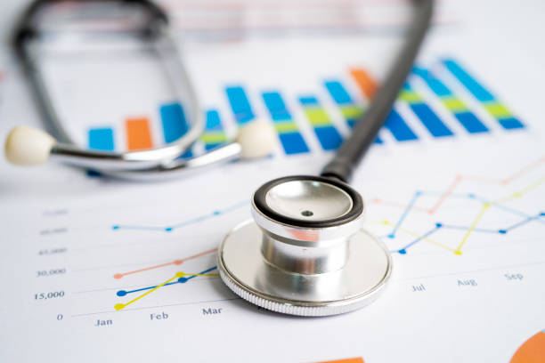 istock Stethoscope on charts and graphs paper, Finance, Account, Statistics, Investment, Analytic research data economy and Business company concept. 1372163256