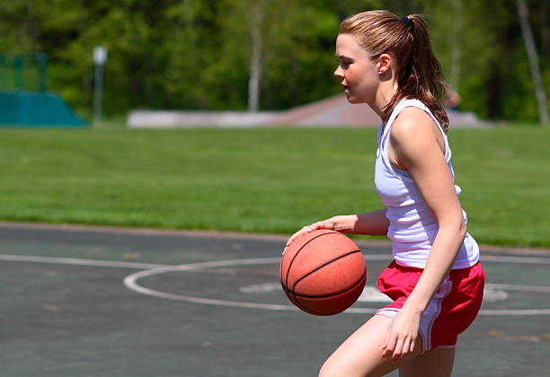 istock Woman playing basketball 137216560