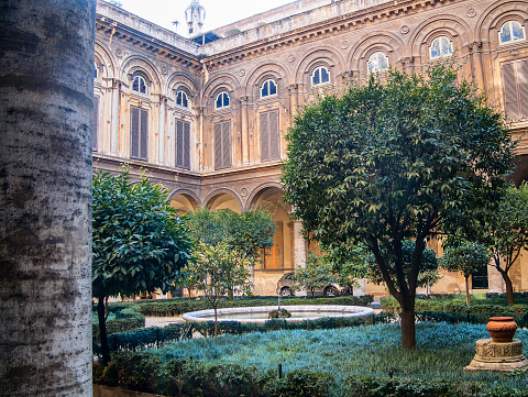 ROME, ITALY - FEBRUARY 24, 2012: Courtyard of Palazzo Doria Pamphili on Via del Corso with fruitful trees. Entrance is public