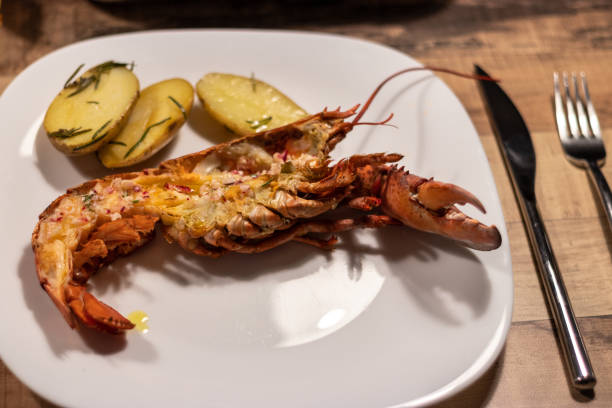 istock Grilled lobster on a plate with potatoes 1372167772