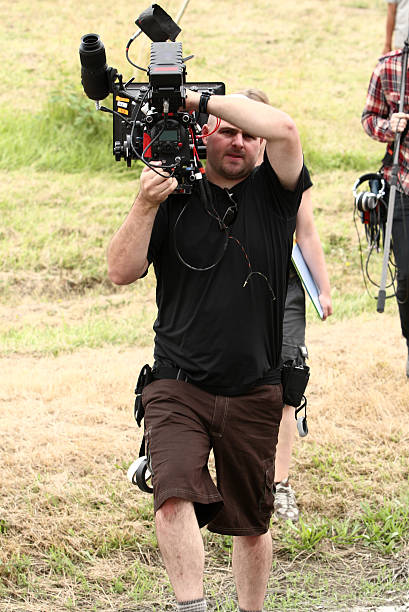 istock Man carrying cinema camera 137216778