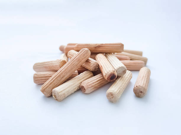 istock Wooden dowels for assembling furniture on white background. Front view 1372168196