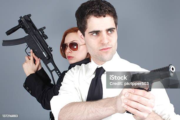 Armed Couple Stock Photo - Download Image Now - 20-29 Years, Adult, Beautiful People