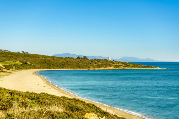 istock Coast with sandy beach and lighthouse, Spain. 1372169477