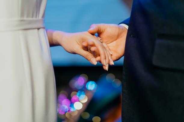 Asian couple hands with wedding rings