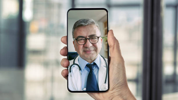 istock Doctor talking on mobile phone 1372172198