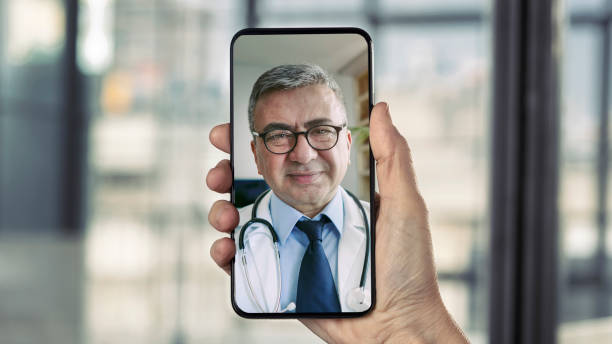 Doctor talking on mobile phone stock photo