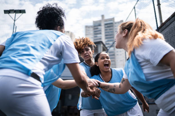 istock Female soccer team huddling and celebrating before training or match 1372172414