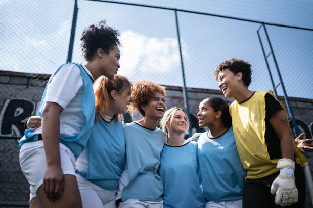 istock Happy female soccer team arm around 1372172421