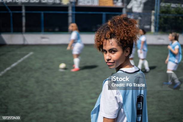 Portrait Of A Young Female Soccer Player In A Sports Court Stock Photo - Download Image Now