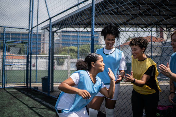 istock Female soccer players shaking hands before the match 1372172434