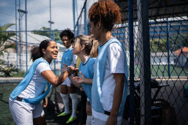 istock Female soccer players shaking hands before the match 1372172445
