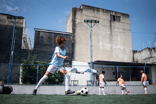 Female soccer player training
