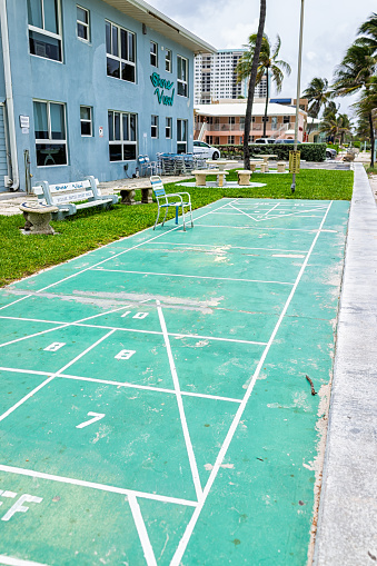 Hollywood, USA - July 13, 2021: North Miami, Hollywood beach, Florida near broadwalk and beach beachfront resort building retro vintage boutique motel hotel called Shore View with shuffleboard game