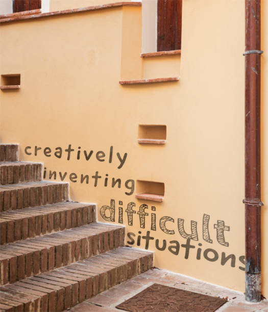 Creatively inventing difficult situations Staircases as architectural barriers. *** The text was digitally superimposed and a release is provided *** motto stock pictures, royalty-free photos & images