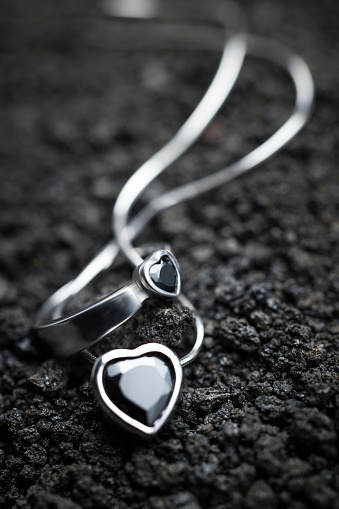beautiful ring and necklace on the volcanic rocks