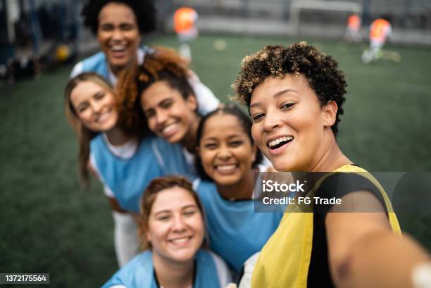 Female Soccer Players Filming Or Taking Selfies Camera Point Of View Stock Photo - Download Image Now