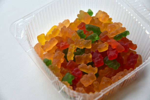 istock Plastic box with marmalade bears on a white background 1372176586