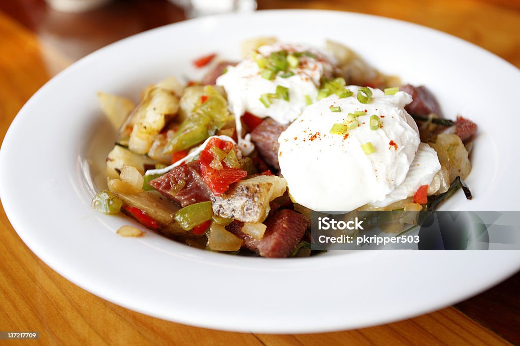 Corned beef hash Corned beef hash with poached eggs. Corned Beef Hash Stock Photo