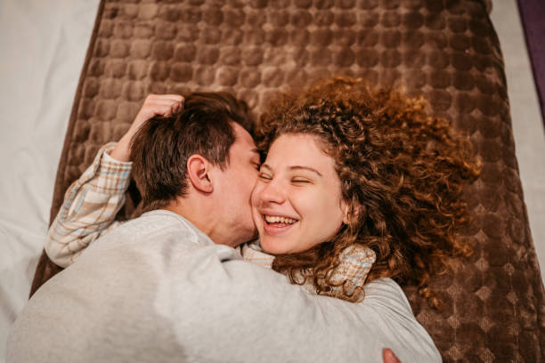 istock Young Couple Lying On The Bed 1372177591