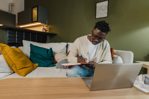 istock Young African American man attends an online course 1372180598