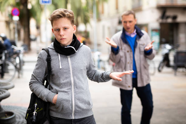istock Upset teenage boy making stop gesture to dissatisfied bypasser 1372180749