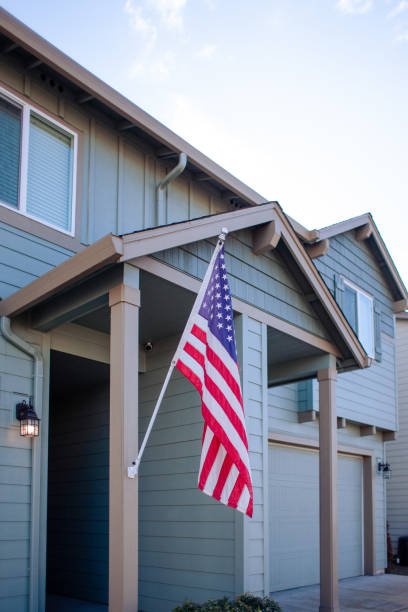 istock American Flag Outside Residential Building 1372181797