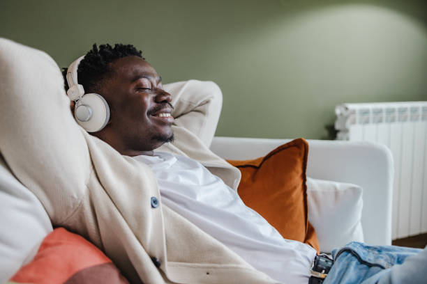 istock Young African-American man relaxing at home 1372181846