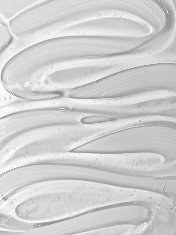 Textura de gel de suero transparente sobre fondo blanco. Muestra de textura de burbuja del producto para el cuidado de la piel. photo