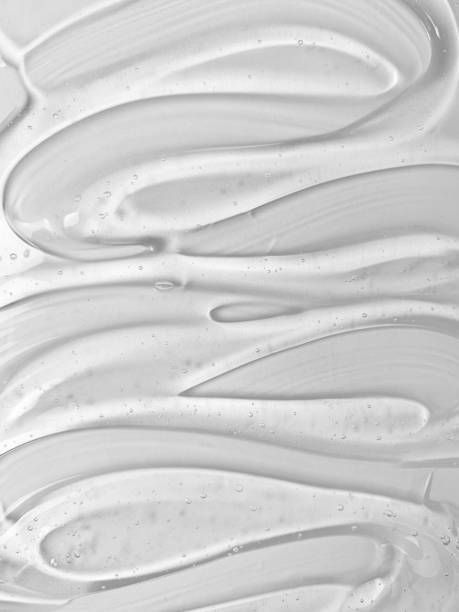 transparent serum gel texture on white background. skin care product bubble texture swatch. - facial cleanser imagens e fotografias de stock