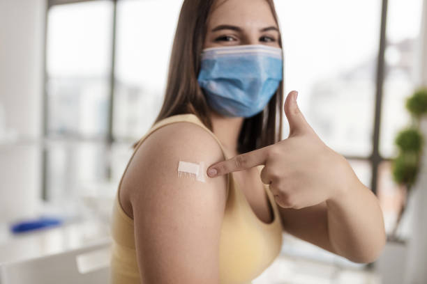 istock Teenager portrait after vaccination. 1372184302