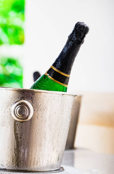 istock bottle of champagne in a bucket 1372184683