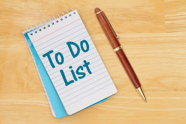 istock To do list on a notepad on a wood desk with a pen 1372185967